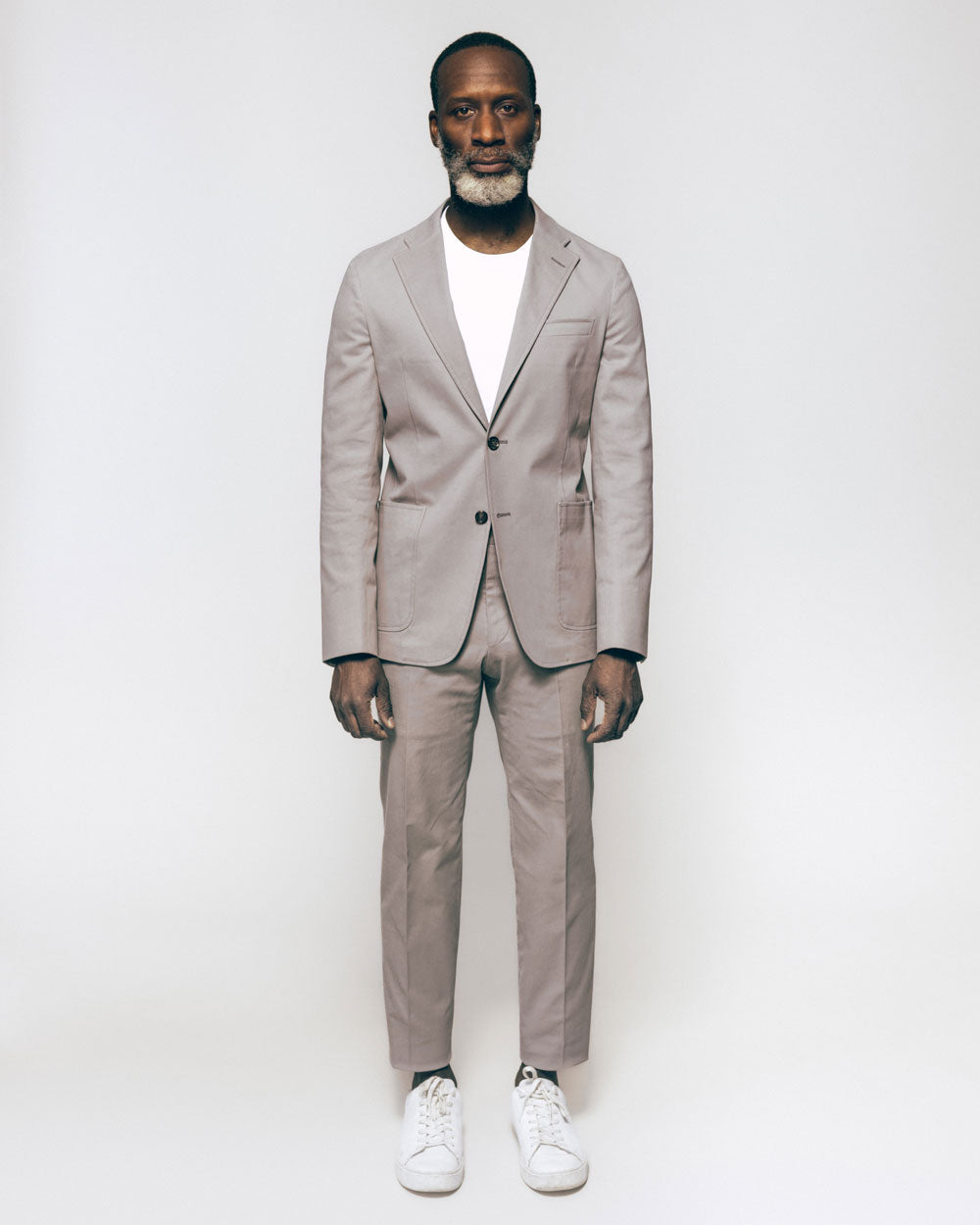 Man with light grey greenflex suit